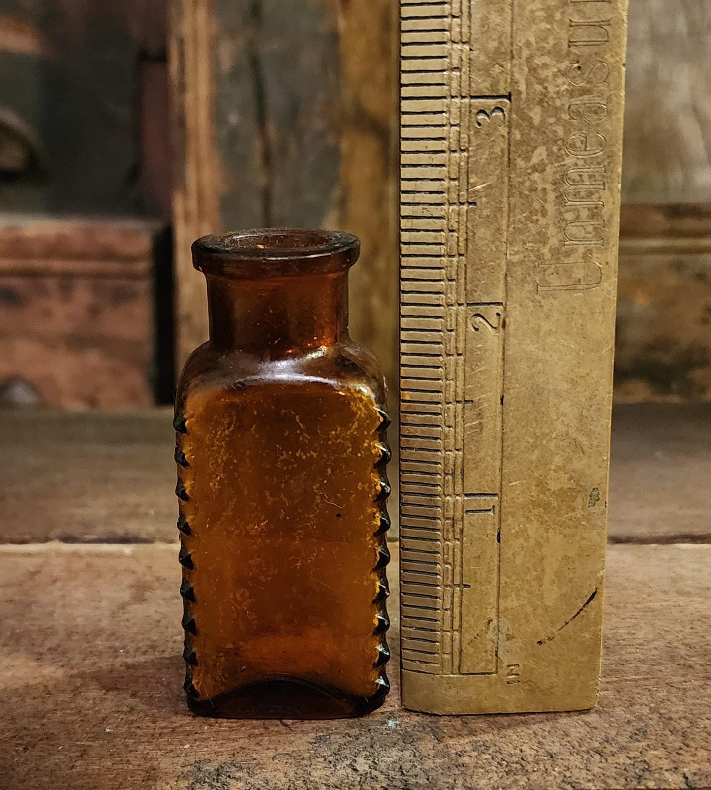 Antique Embossed Amber Poison Bottle