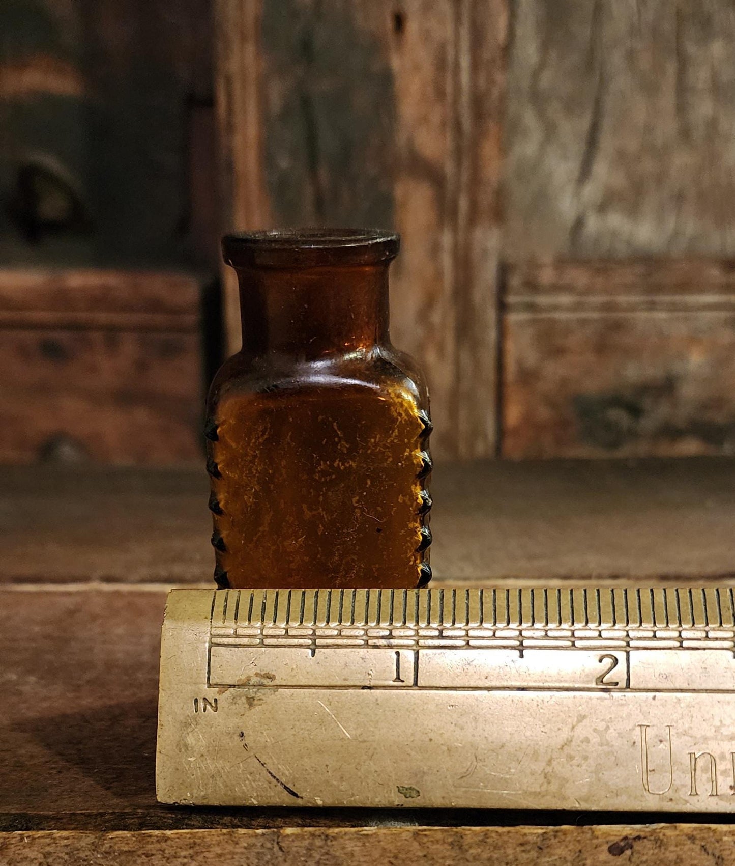 Antique Embossed Amber Poison Bottle