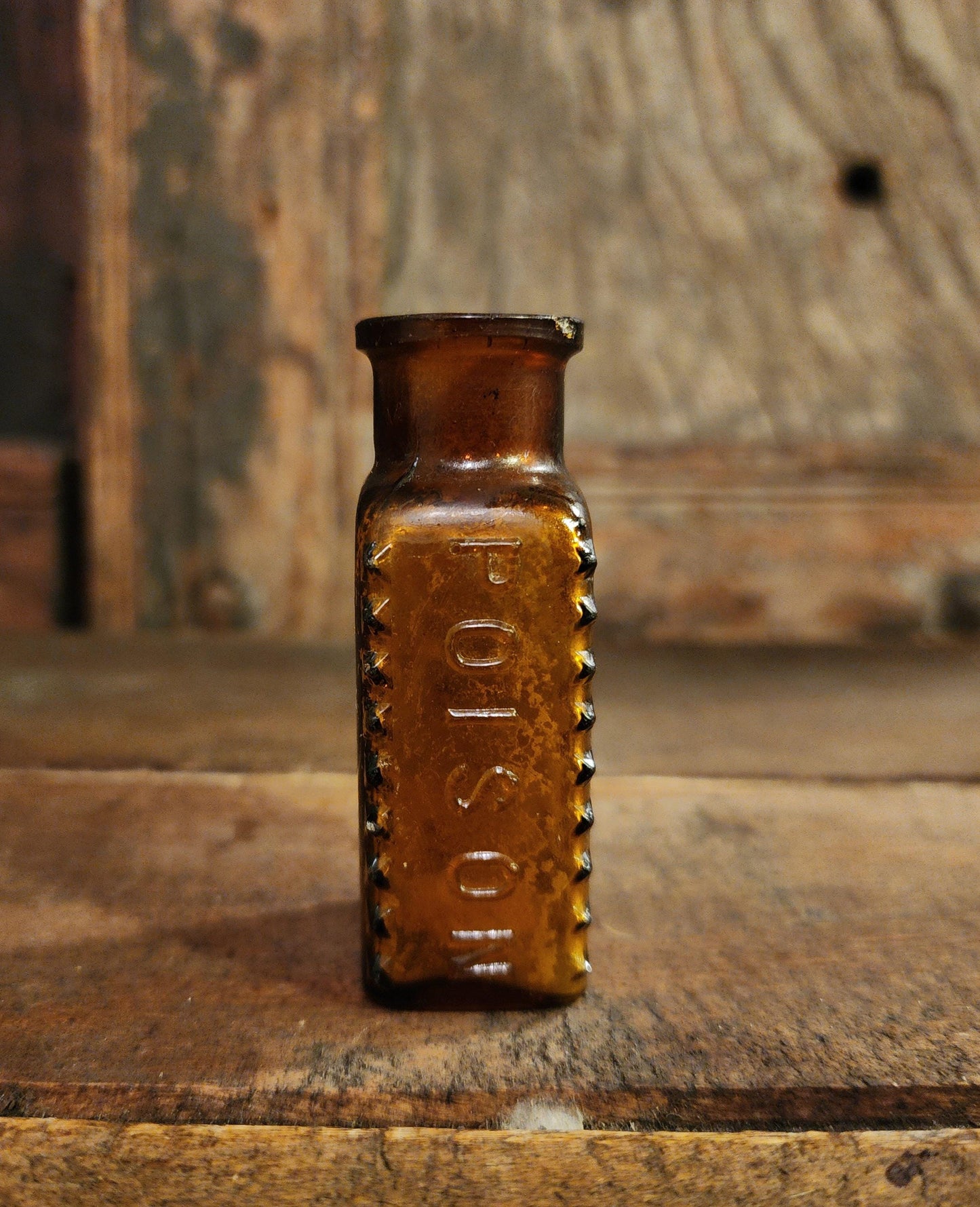 Antique Embossed Amber Poison Bottle